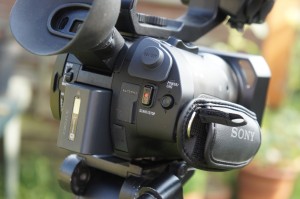 The back of the handgrip and the small joystick.